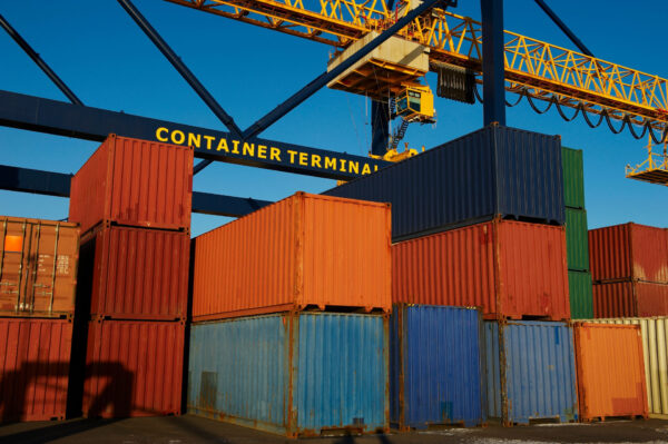 A group of colourful shipping containers are an example of how asset tracking systems can be used in businesses. 